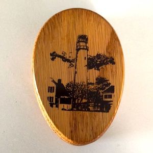 Oak Amish-made magic marble towel holder with lighthouse design.